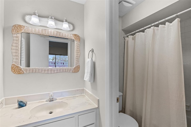 bathroom featuring toilet and vanity