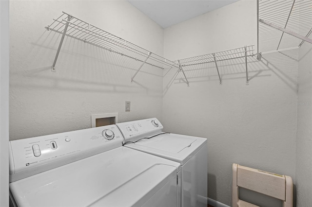washroom with washer and dryer and laundry area