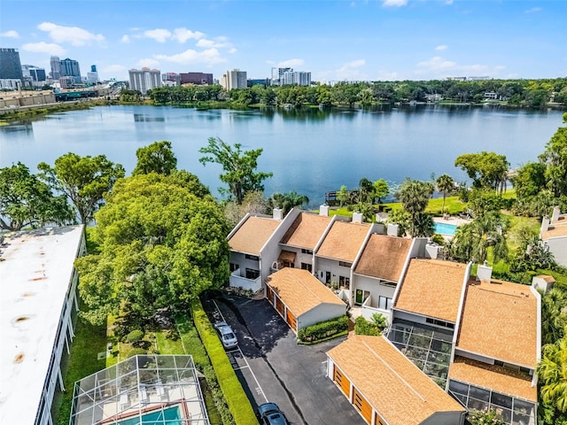 birds eye view of property featuring a view of city and a water view