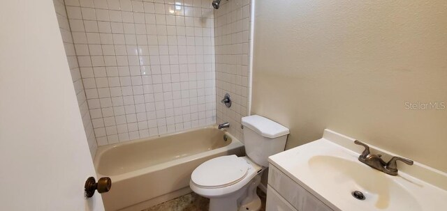 bathroom featuring vanity,  shower combination, and toilet