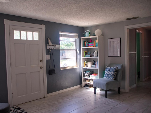 15 Estrella Rd, Debary, FL 32713 - foyer with a textured ceiling and baseboards