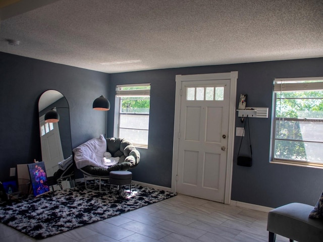 15 Estrella Rd, Debary, FL 32713 - foyer entrance with healthy amount of natural light, a textured ceiling, and baseboards
