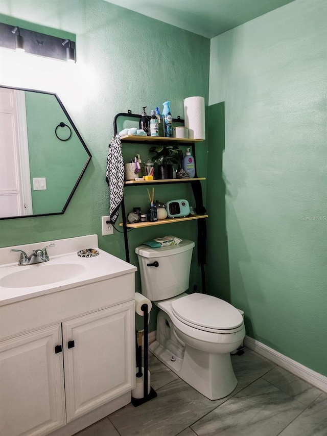 15 Estrella Rd, Debary, FL 32713 - half bath featuring toilet, a textured wall, vanity, and baseboards