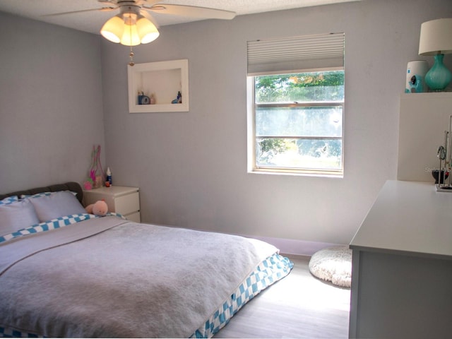 15 Estrella Rd, Debary, FL 32713 - bedroom with baseboards, a ceiling fan, and wood finished floors