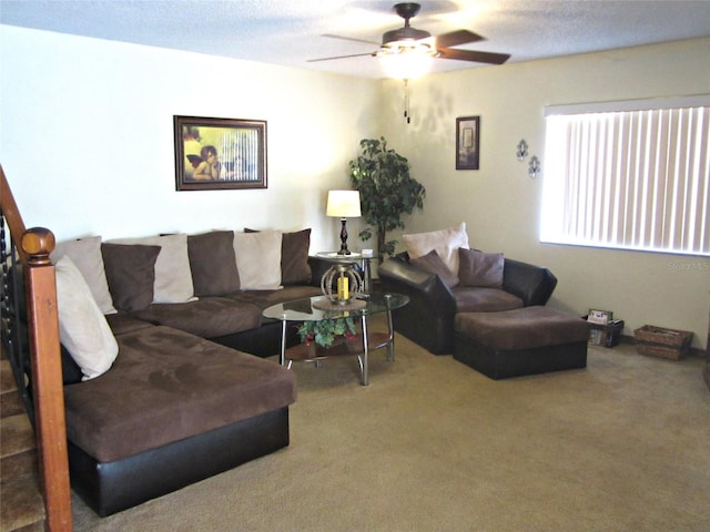 2073 Oak Meadow Cir S, Daytona, FL 32119 - carpeted living area with a textured ceiling and a ceiling fan