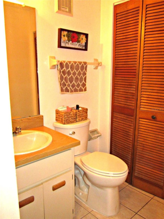 2073 Oak Meadow Cir S, Daytona, FL 32119 - half bath featuring tile patterned floors, a closet, vanity, toilet, and visible vents