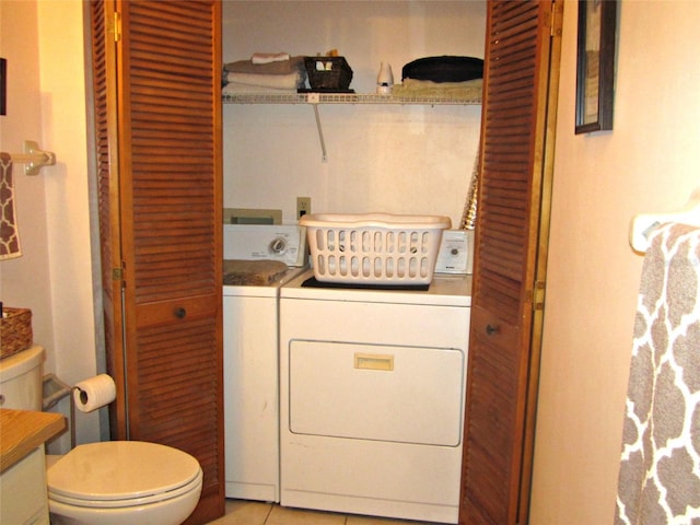 2073 Oak Meadow Cir S, Daytona, FL 32119 - laundry area with light tile patterned flooring, laundry area, and separate washer and dryer