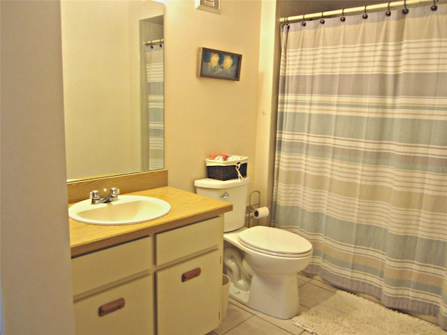 2073 Oak Meadow Cir S, Daytona, FL 32119 - full bath with toilet, vanity, tile patterned floors, and curtained shower