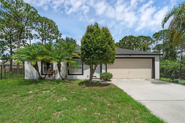 969 Commerce Rd SE, Palm Bay, FL 32909 - view of front of property featuring concrete driveway, a garage, and stucco siding