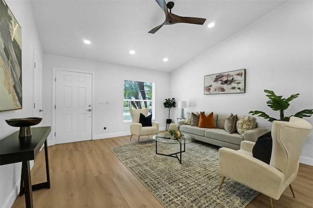 969 Commerce Rd SE, Palm Bay, FL 32909 - living room featuring light wood finished floors, a ceiling fan, vaulted ceiling, baseboards, and recessed lighting