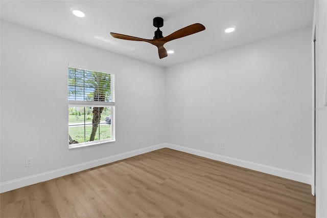 969 Commerce Rd SE, Palm Bay, FL 32909 - unfurnished room featuring a ceiling fan, wood finished floors, baseboards, and recessed lighting