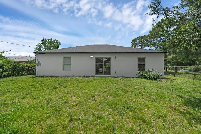 969 Commerce Rd SE, Palm Bay, FL 32909 - rear view of property featuring stucco siding