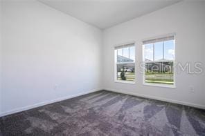 1163 James Paul Rd, Davenport, FL 33837 - spare room featuring baseboards and carpet flooring