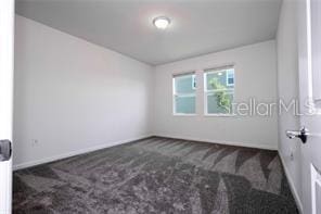 1163 James Paul Rd, Davenport, FL 33837 - empty room featuring carpet and baseboards