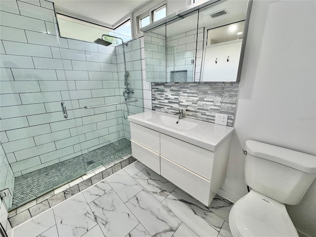 full bath with toilet, visible vents, marble finish floor, a shower stall, and vanity