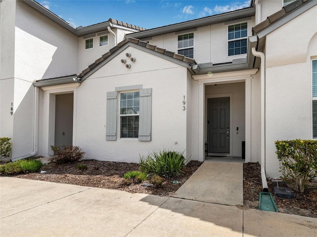 193 Captiva Dr, Davenport, FL 33896 - property entrance featuring stucco siding