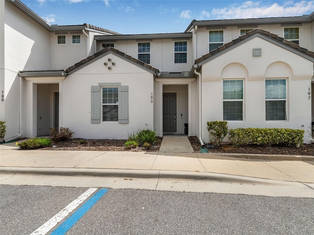 193 Captiva Dr, Davenport, FL 33896 - view of property featuring a tiled roof and stucco siding