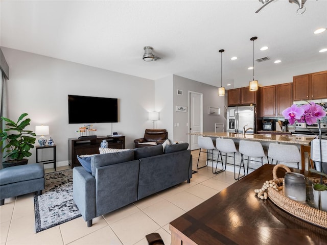 193 Captiva Dr, Davenport, FL 33896 - living room featuring recessed lighting, light tile patterned flooring, and visible vents