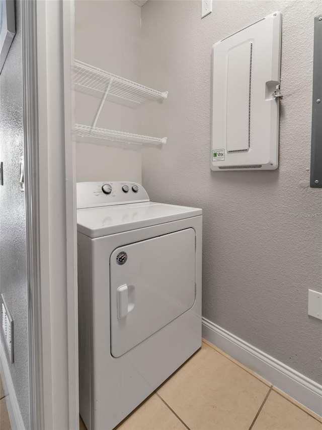 193 Captiva Dr, Davenport, FL 33896 - laundry room with washer / dryer, baseboards, tile patterned flooring, and laundry area
