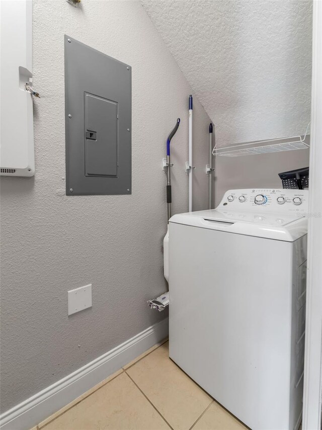 193 Captiva Dr, Davenport, FL 33896 - clothes washing area with laundry area, electric panel, a textured ceiling, light tile patterned floors, and washer / dryer