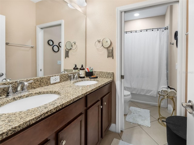 193 Captiva Dr, Davenport, FL 33896 - full bath featuring double vanity, toilet, tile patterned floors, and a sink