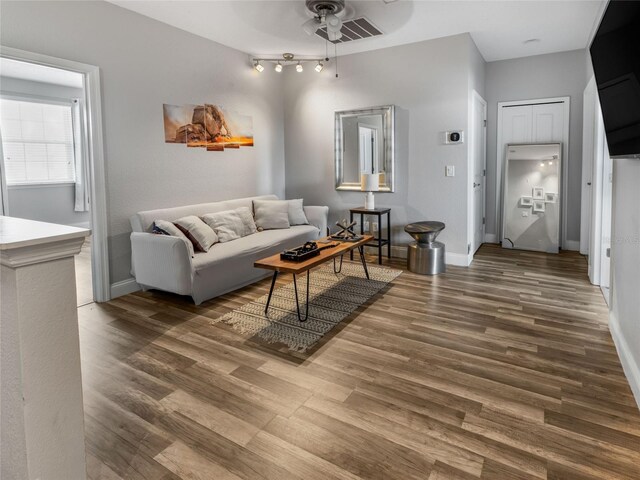 193 Captiva Dr, Davenport, FL 33896 - living area with baseboards, a ceiling fan, and wood finished floors