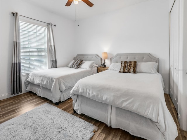 193 Captiva Dr, Davenport, FL 33896 - bedroom featuring baseboards, a ceiling fan, and wood finished floors