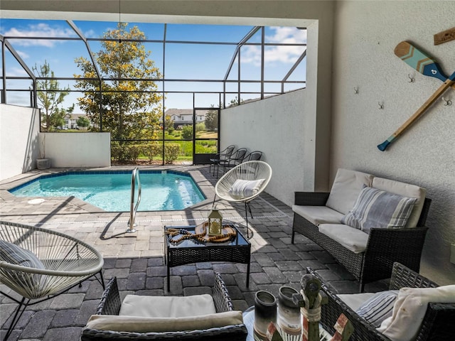 193 Captiva Dr, Davenport, FL 33896 - outdoor pool with a patio, glass enclosure, and an outdoor hangout area