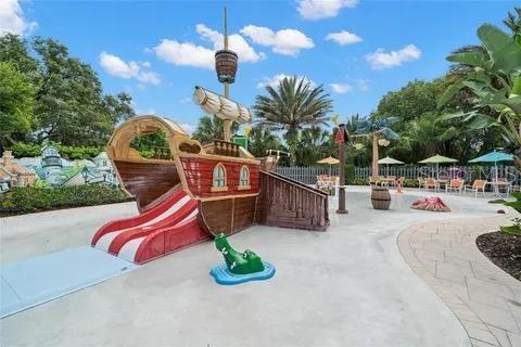 193 Captiva Dr, Davenport, FL 33896 - communal playground featuring fence and a patio area