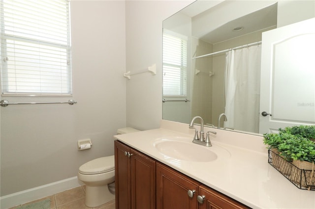 full bathroom with tile patterned flooring, a shower with shower curtain, toilet, vanity, and baseboards