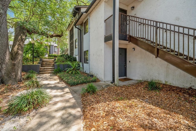 150 Waterfall Way Unit 102, Altamonte Springs, FL 32714 - view of side of property with stairs and stucco siding
