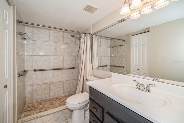150 Waterfall Way Unit 102, Altamonte Springs, FL 32714 - full bathroom with toilet, visible vents, vanity, and a tile shower