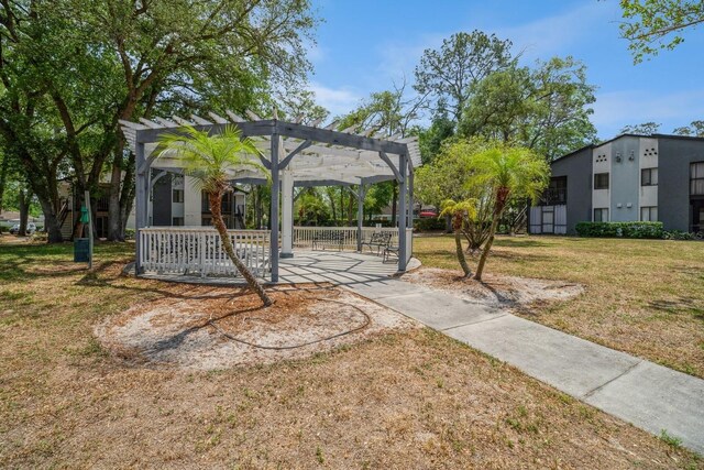 150 Waterfall Way Unit 102, Altamonte Springs, FL 32714 - view of property's community with a pergola, a lawn, and a patio area