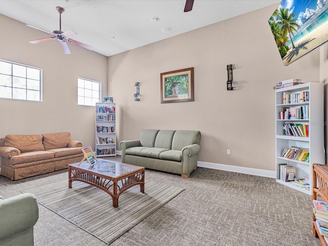 411 Cabello Dr, Davenport, FL 33837 - living room with carpet floors, a ceiling fan, and baseboards