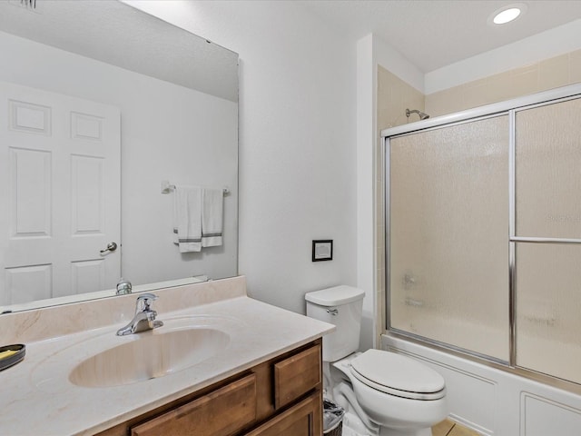 411 Cabello Dr, Davenport, FL 33837 - bathroom with recessed lighting, vanity, enclosed tub / shower combo, and toilet