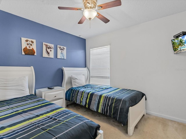 411 Cabello Dr, Davenport, FL 33837 - carpeted bedroom with baseboards, a textured ceiling, and ceiling fan