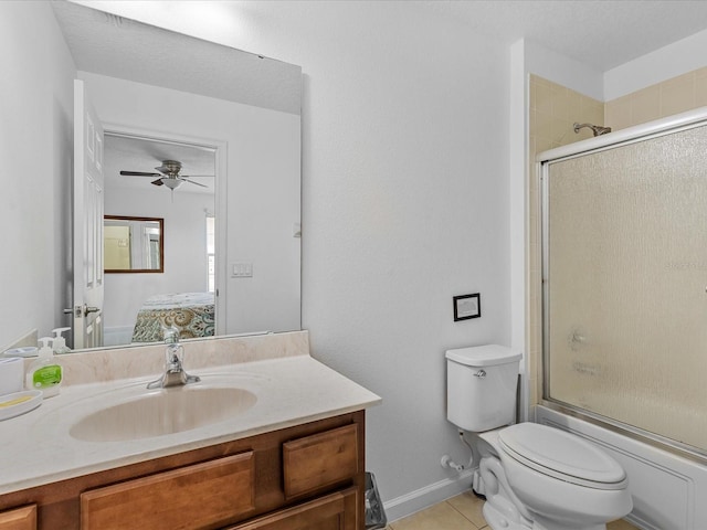 411 Cabello Dr, Davenport, FL 33837 - ensuite bathroom with tile patterned flooring, vanity, ensuite bath, toilet, and a ceiling fan