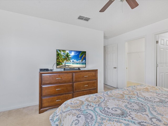 411 Cabello Dr, Davenport, FL 33837 - bedroom with visible vents, a closet, baseboards, light colored carpet, and a ceiling fan