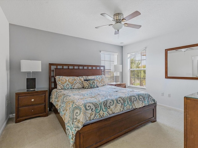 411 Cabello Dr, Davenport, FL 33837 - carpeted bedroom featuring a textured ceiling, baseboards, and ceiling fan