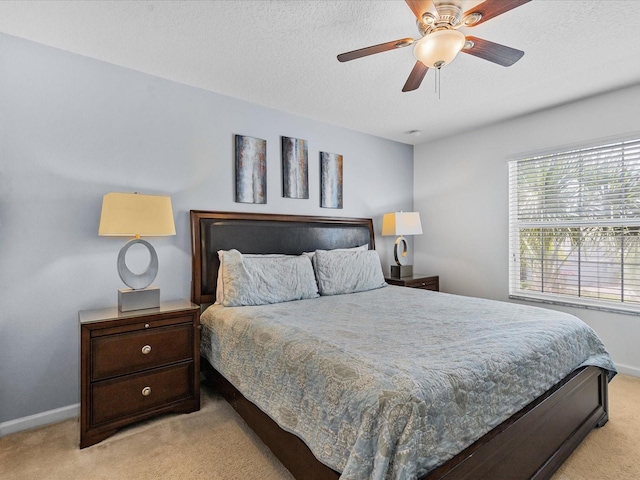 411 Cabello Dr, Davenport, FL 33837 - bedroom with baseboards, a textured ceiling, and light carpet