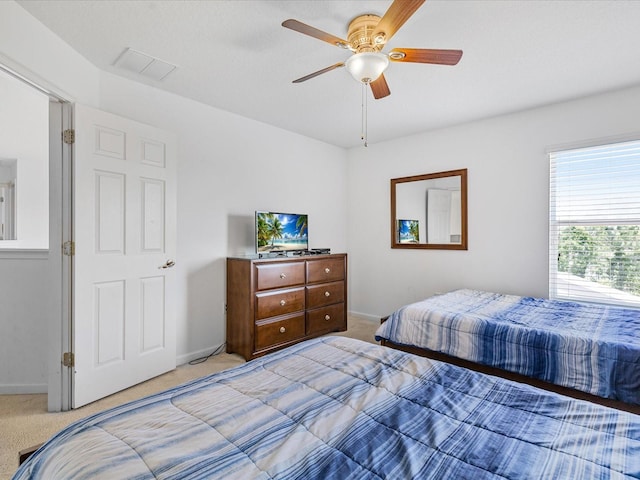 411 Cabello Dr, Davenport, FL 33837 - bedroom featuring visible vents, baseboards, ceiling fan, and light carpet