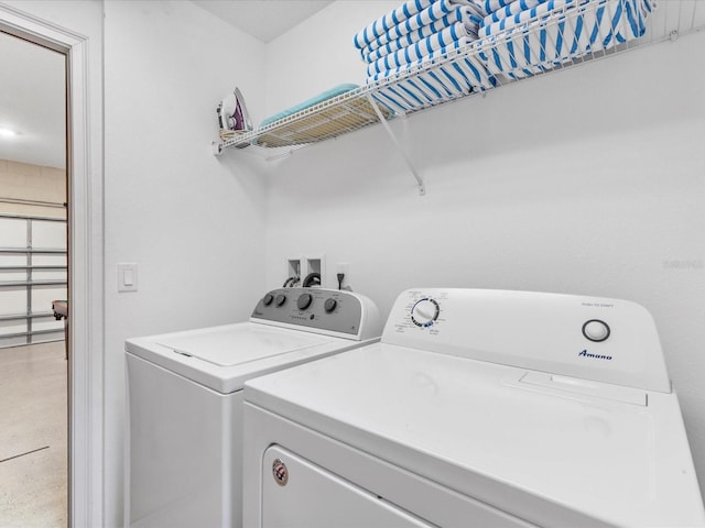 411 Cabello Dr, Davenport, FL 33837 - clothes washing area with washing machine and clothes dryer and laundry area