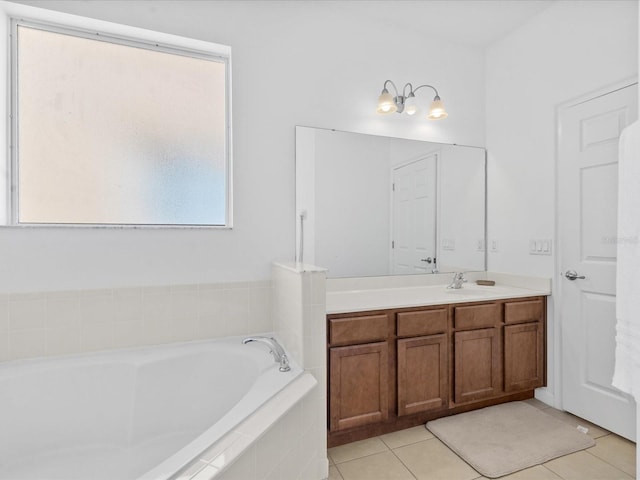 411 Cabello Dr, Davenport, FL 33837 - bathroom featuring vanity, tile patterned flooring, and a garden tub