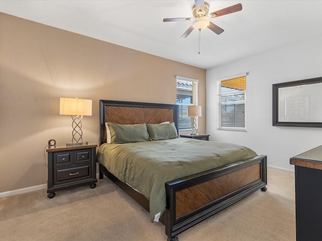 411 Cabello Dr, Davenport, FL 33837 - bedroom with light colored carpet, a ceiling fan, and baseboards