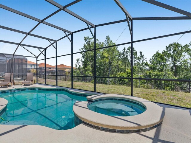 411 Cabello Dr, Davenport, FL 33837 - view of pool with a lawn, glass enclosure, a pool with connected hot tub, and a patio