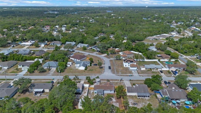 2763 E Waco Dr, Deltona, FL 32738 - aerial overview of property's location with nearby suburban area and a heavily wooded area