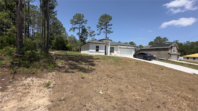 ranch-style home featuring driveway and an attached garage