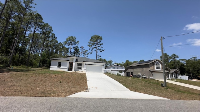 view of front of home featuring driveway and an attached garage