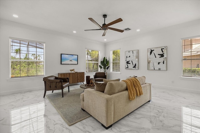living room featuring marble finish floors, baseboards, a ceiling fan, recessed lighting, and crown molding