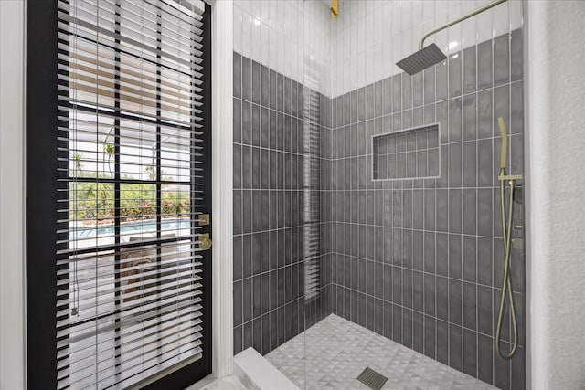 full bathroom with a tile shower